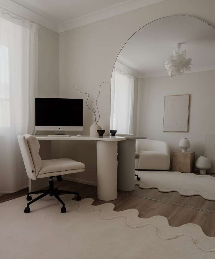 Minimalist All-White Workspace with Sculptural Elements