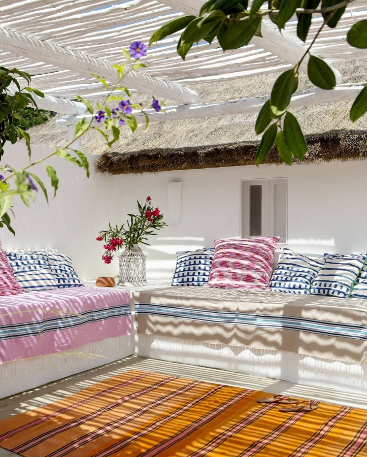 Bright Mediterranean Terrace with Patterned Textiles