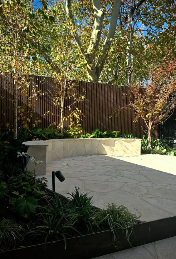 Flagstone Patio with Stone Bench and Trees