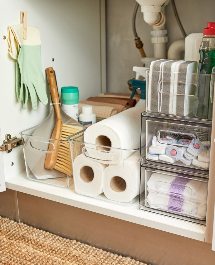 Kitchen Sink with Hanging Gloves and Stacked Bins