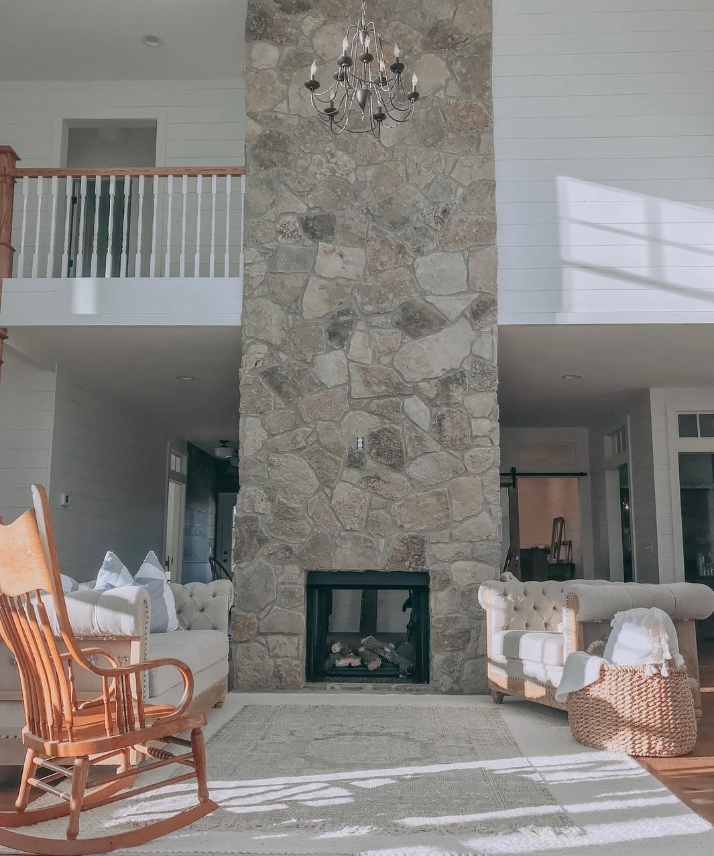 Floor-to-Ceiling Stacked Stone Fireplace