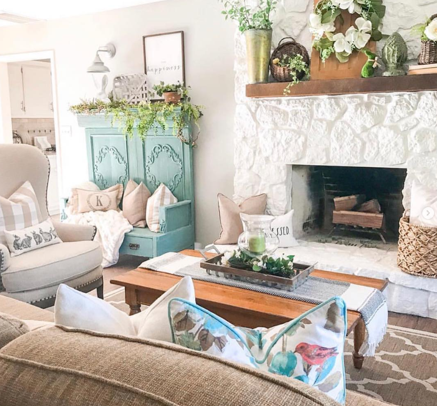 Painted Stone Fireplace with Teal Armoire